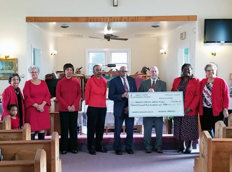 Check presentation attendees shown are (l-r) Carolyn A. Morris; Ava Marie Phillipe, granddaughter of Rev. Burns; Chief Natosha N. Carmine; Shorel Clark; Joyce Rickards; Charles S. Cramer Sr.; Executive Director of Beebe Oncology Services Barry Hamp; the Rev. Marjorie Belmont-Burns; and Betty J. Streett. SUBMITTED PHOTO